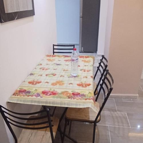 a table with a table cloth on top of it at Résidence Rahma in Hammam Chott