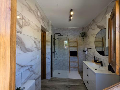 a bathroom with a shower and a sink at La Petite Finca in Elche