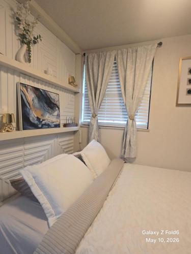 a bedroom with a bed and a window at Stacy's Retreat in Fairview Heights