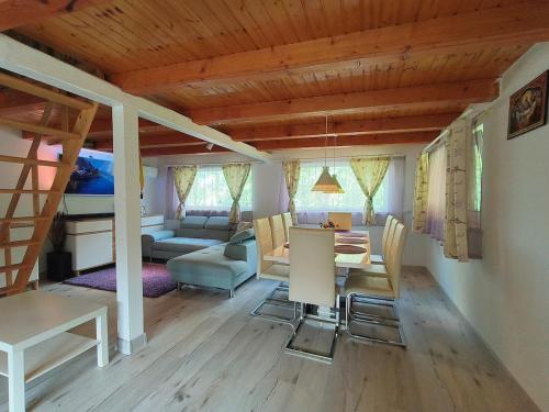 a living room with a table and a couch at Dodo Land in Săcel