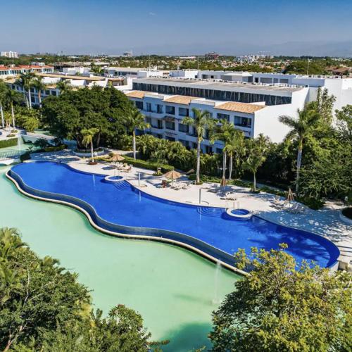 an aerial view of a resort with a pool at Departamento Taheima Nuevo Vallarta in Nuevo Vallarta