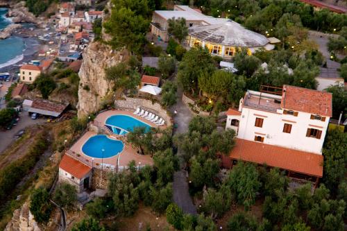 an aerial view of a house with a swimming pool at Villaggio Villa Lubrense in Massa Lubrense