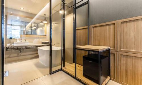 a bathroom with a shower and a sink and a toilet at Anseong Nomad Hotel in Anseong