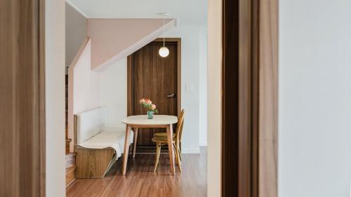 a dining room with a table and chairs in a room at Chuncheon Rehouse in Chuncheon
