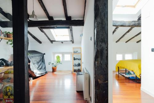 a bedroom and a living room with a bed at GOZATEGI - Photo studio in Irún