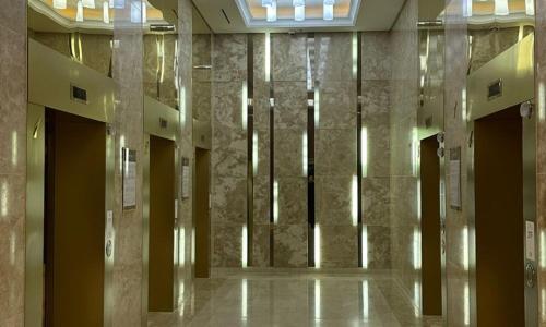a hallway of a building with columns and lights at Centum City Hotel in Busan