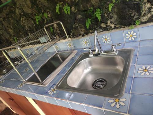 a sink in a blue tiled counter top at Rincón de la Luna in Tepoztlán