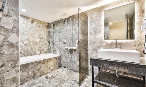 a bathroom with a sink and a mirror at Beyond Hotel in Incheon