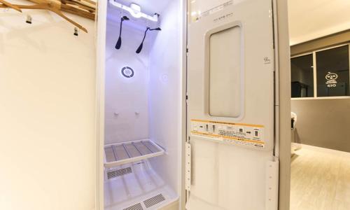 a white refrigerator with its door open in a room at The Stay Series in Daegu