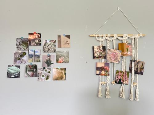 a bunch of pictures hanging on a wall at Lakeside Home on Second Floor in Langford