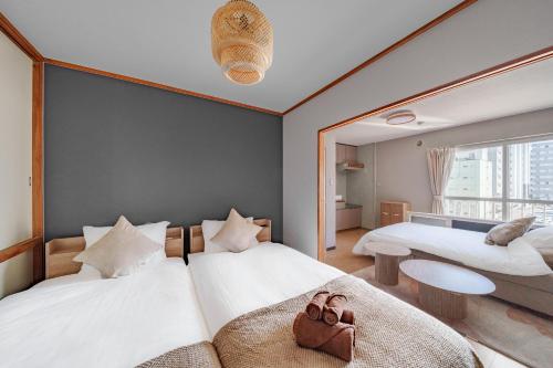 Den SUSUKINO ROOMS