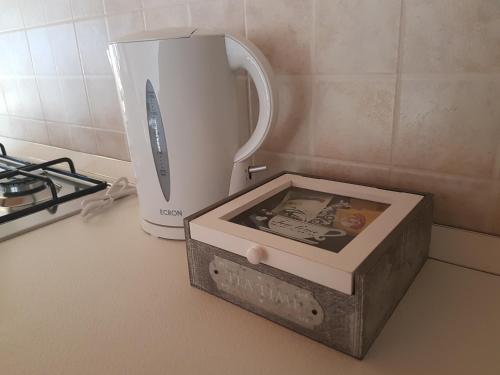 a box sitting on a counter next to a blender at Corte Pomponazza in Mantova
