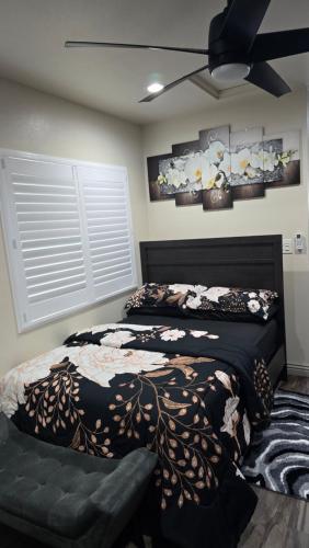 a bedroom with two beds and a ceiling fan at Cozy Tiny Home For 2 People Studio Type in Norwalk