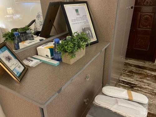 a bathroom with a vanity with a toilet and a mirror at بيت لانا in Abha