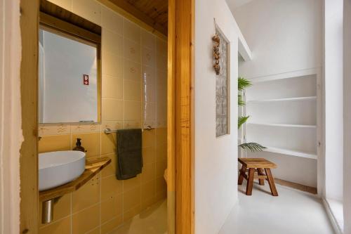 a bathroom with a sink and a mirror at Casa Miclá in Lagos