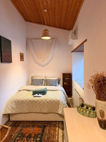 a bedroom with a bed in a room with a window at Kassandra's Cottage in Vasa