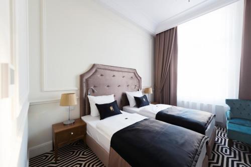 Кровать или кровати в номере Hotel Royal & Spa