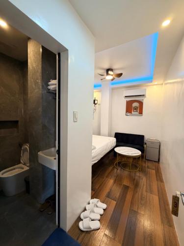 a small room with a bed and a table at Manatad Transient Deluxe 3 in Surigao