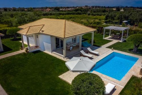 an aerial view of a villa with a swimming pool at Villa Evanna in Lefkimmi