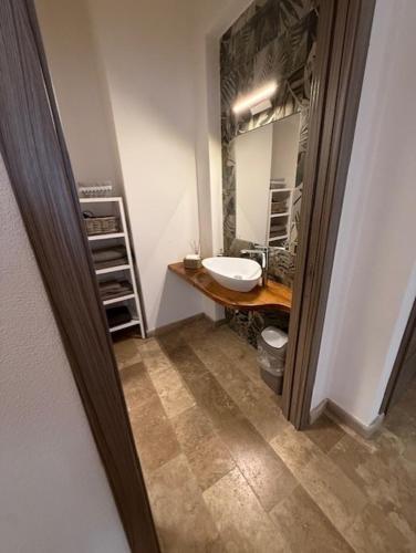 a bathroom with a sink and a mirror at Alla botte degli Orsini in Attigliano