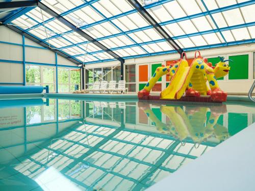 a swimming pool with at Vakantiepark 't Strandheem in Opende