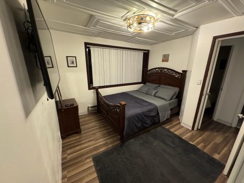 a bedroom with a bed and a large window at Anchorage Fireoved Experience in Anchorage