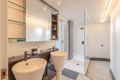 a bathroom with a sink and a mirror at Villa Cela in El Masnou