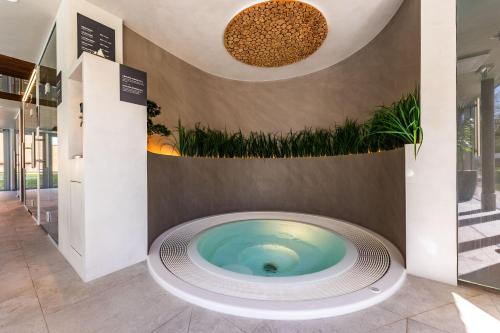 a jacuzzi tub in the lobby of a building at Johan Suites & Spa in Kuressaare