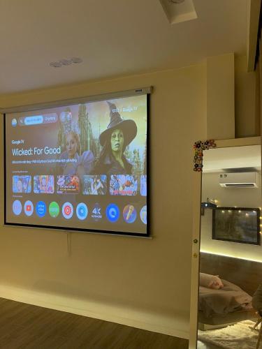 a flat screen tv hanging on a wall at AN BÌNH Home in Hai Phong