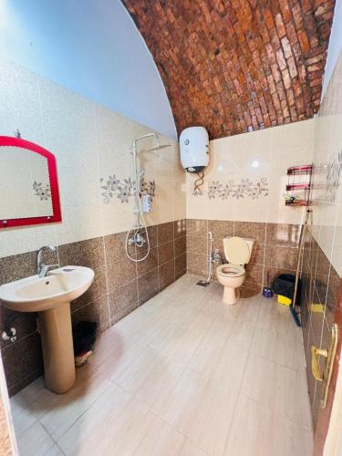 a bathroom with a sink and a toilet at Dara guest House in Aswan