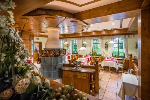 a large room with a kitchen and a living room at Landgasthof zum Mühlenteich in Eggersdorf