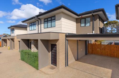 a large house with a driveway at Seaside Luxe at Vila Morava in Rosebud