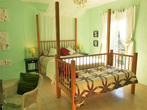 a bedroom with a bed and a chair and a window at Casa Pietra - Atessa in Atessa