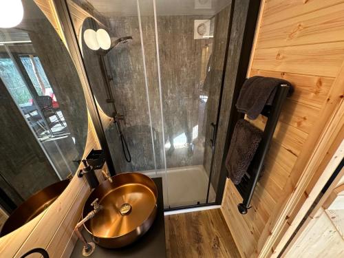 a bathroom with a copper sink and a shower at Scranton luxury fishing pod with private fishing Jetty in Spilsby