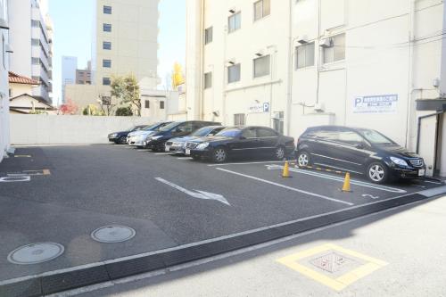 a row of cars parked in a parking lot at Kawasaki Hotel Park in Kawasaki