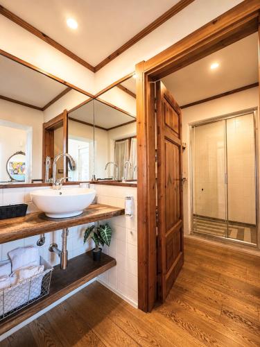 a bathroom with a sink and a mirror at Palazzo Bolasco in Alghero