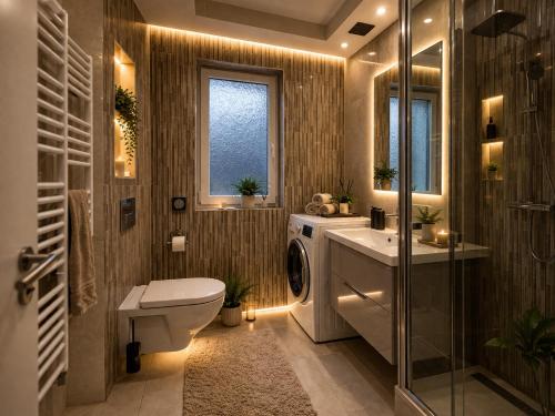 a bathroom with a toilet and a sink and a washing machine at Holiday house "Mimoza" 2 massage pools in Otočac