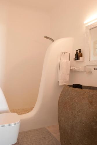 a bathroom with a toilet and a sink at Chrysalis Nature Villa 9 in Kampos Paros