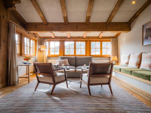 a living room with a couch and chairs at Spa & Resort Bachmair Weissach, LUXURY FAMILY RESORT in Rottach-Egern