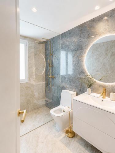 a bathroom with a toilet and a sink at Banana Beach in Marbella