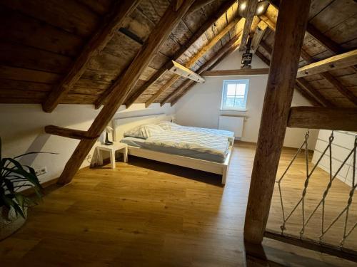a bedroom with a bed in a attic at Ferienscheune Rheingoldhof in Sankt Goar