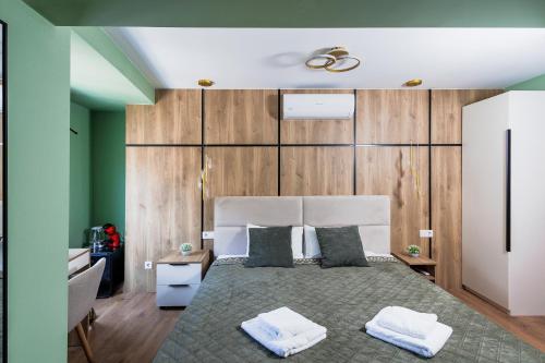 a bedroom with a large bed with two pillows at Vita Verde in Torrevieja