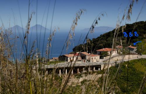 a bridge over a mountain with houses on it at B&B Gàttina in Naso