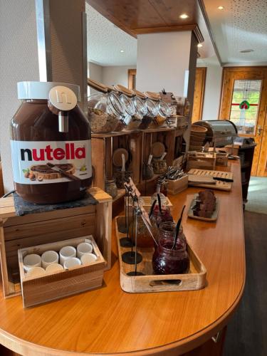 a coffee shop with a counter with eggs on it at Waldhaus am See in Willingen