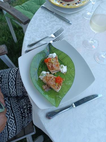 a plate of food on top of a table at La casa di Aurora - Room A - Boutique Hotel in Agios Ioannis Peristerion