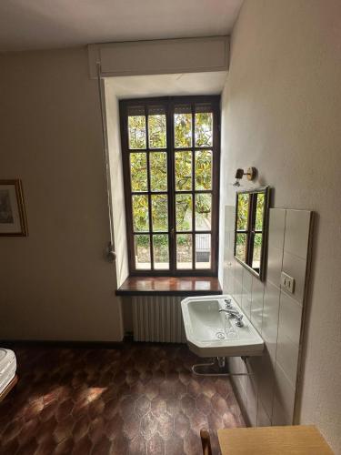 a bathroom with a sink and a window at Villa Elisabetta in Malcesine