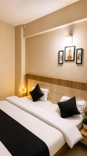 a large bed with two pillows in a room at Hidden house stay in Mathura