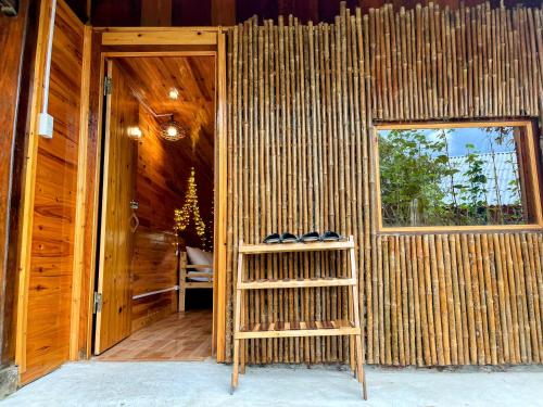 a room with a window and a pair of shoes at The Happy Cozy Corner! in Lao Cai