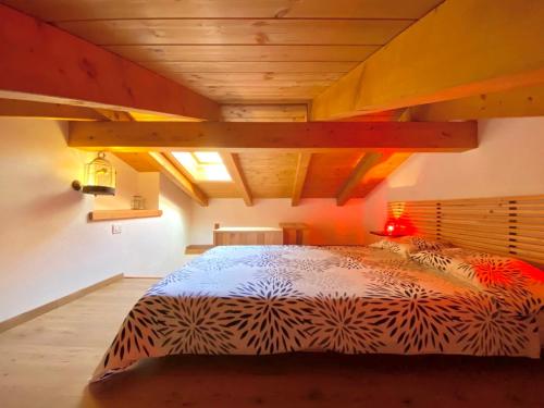 a bedroom with a large bed in a room at Casa Bucaneve & Ciclamino in Gravedona