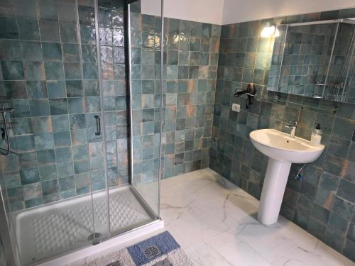 a bathroom with a sink and a shower at Casa Alvarez Tazacorte in Tazacorte